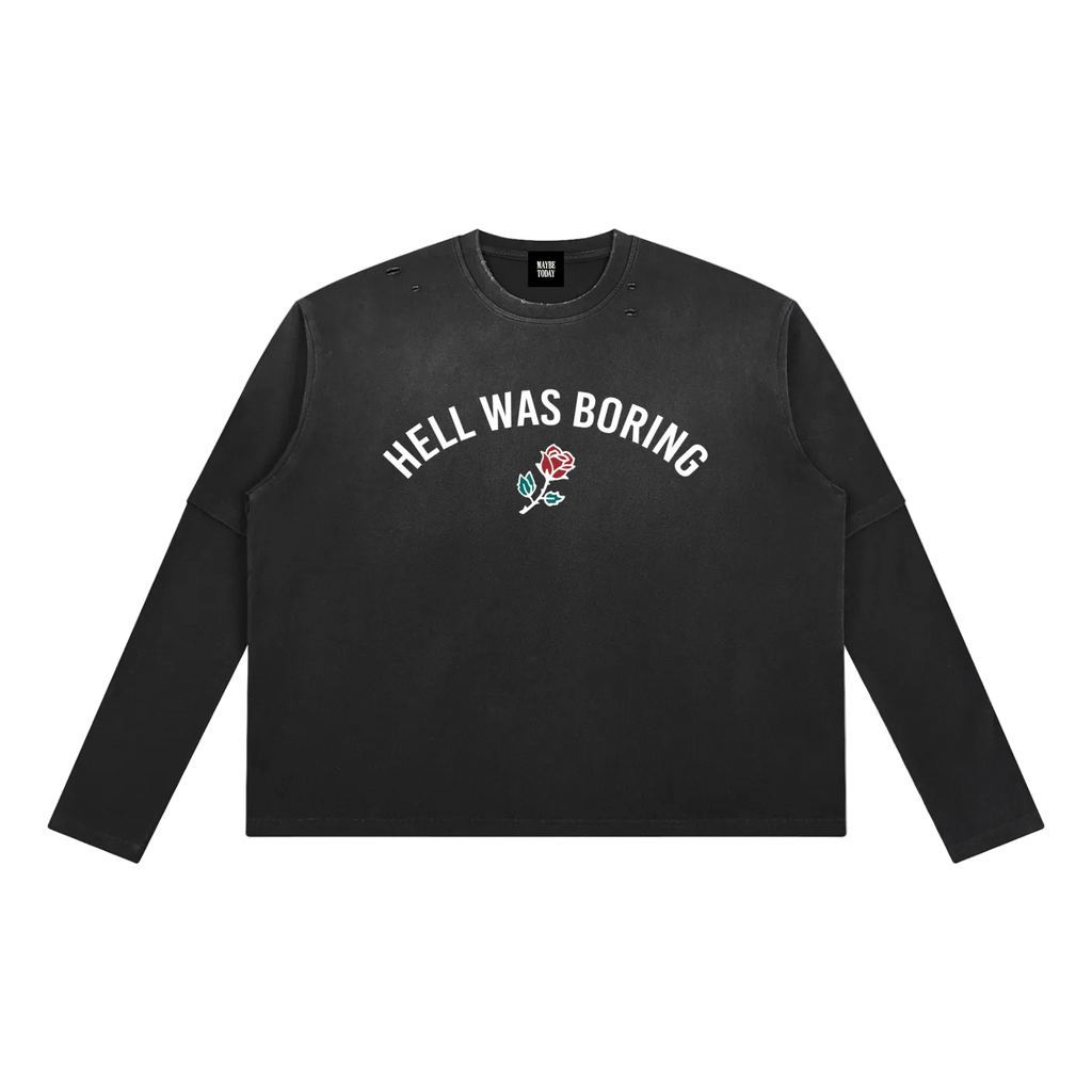 A black long-sleeve crewneck sweatshirt with the words 'STILL GOING' printed in bold white capital letters across the chest, displayed flat against a solid white background.